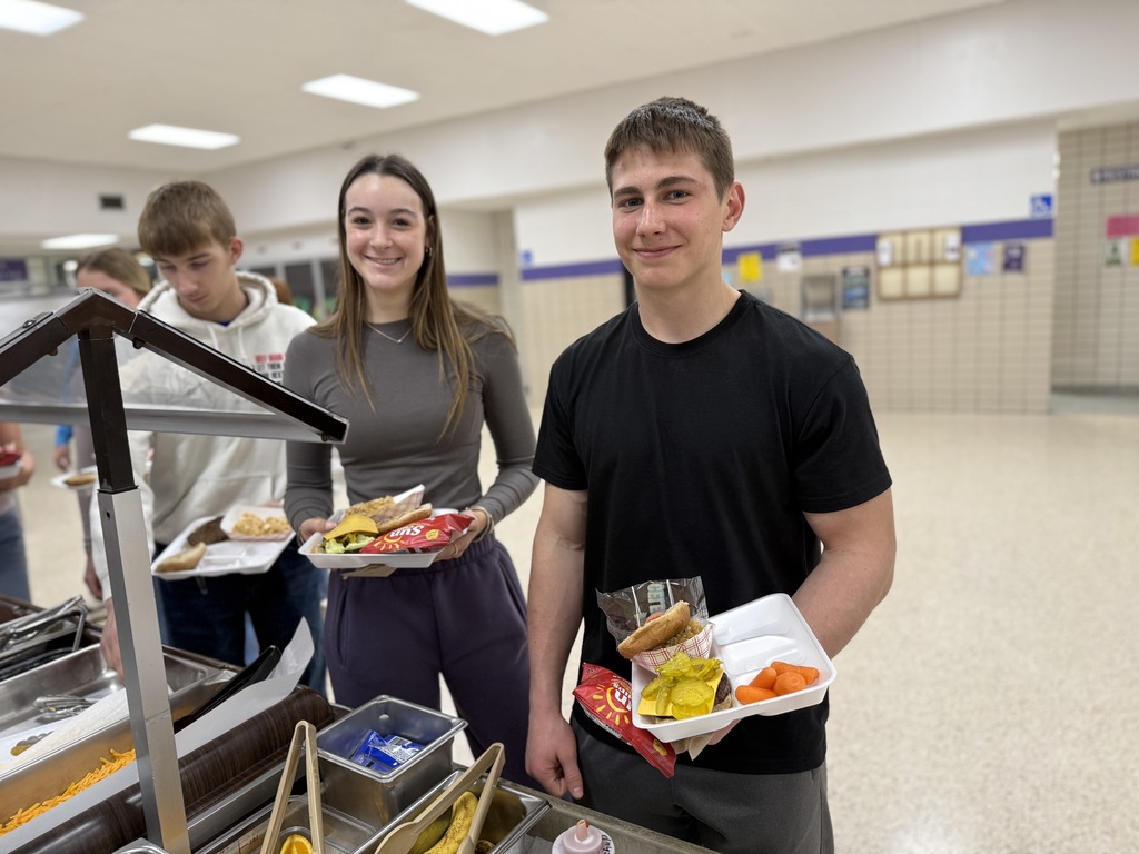 Ella and Case prep their trays during A lunch