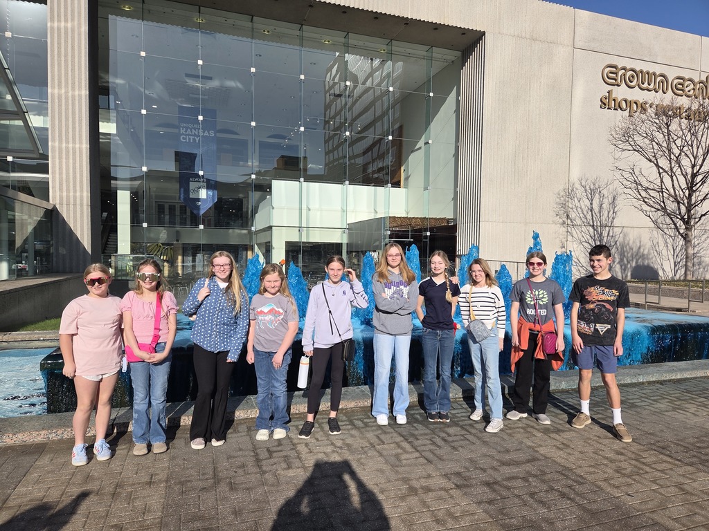 Student 4th thru 8th grade stand in front of the fountain outside the Crown Center shopping center in KC.