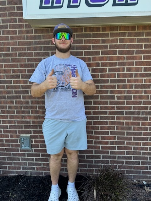 South Harrison National Honor Society students refurbishing the flower bed in front of the high school in honor of Earth Day and ahead of the Academic Awards Ceremony.  Pictured: Ruger Johnson