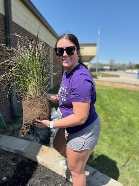 South Harrison National Honor Society students refurbishing the flower bed in front of the high school in honor of Earth Day and ahead of the Academic Awards Ceremony.  Pictured: Emily Burnett