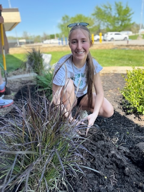 South Harrison National Honor Society students refurbishing the flower bed in front of the high school in honor of Earth Day and ahead of the Academic Awards Ceremony.  Pictured: Abby Owens