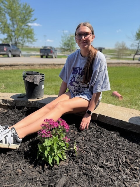 South Harrison National Honor Society students refurbishing the flower bed in front of the high school in honor of Earth Day and ahead of the Academic Awards Ceremony. Pictured: Addison Polley
