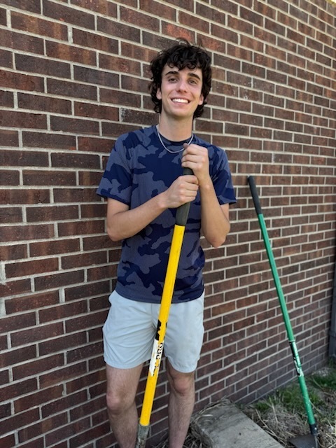 South Harrison National Honor Society students refurbishing the flower bed in front of the high school in honor of Earth Day and ahead of the Academic Awards Ceremony.  Pictured: Brody Templeton