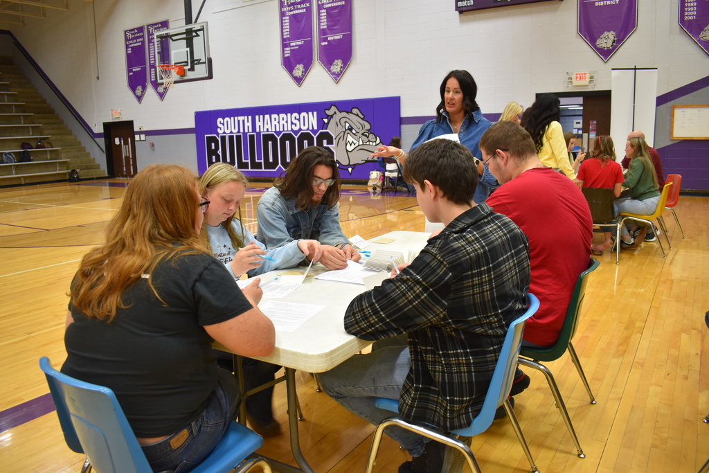 Senior Day at South Harrison; picture Kalsey McCall teaching the etiquette of letter writing
