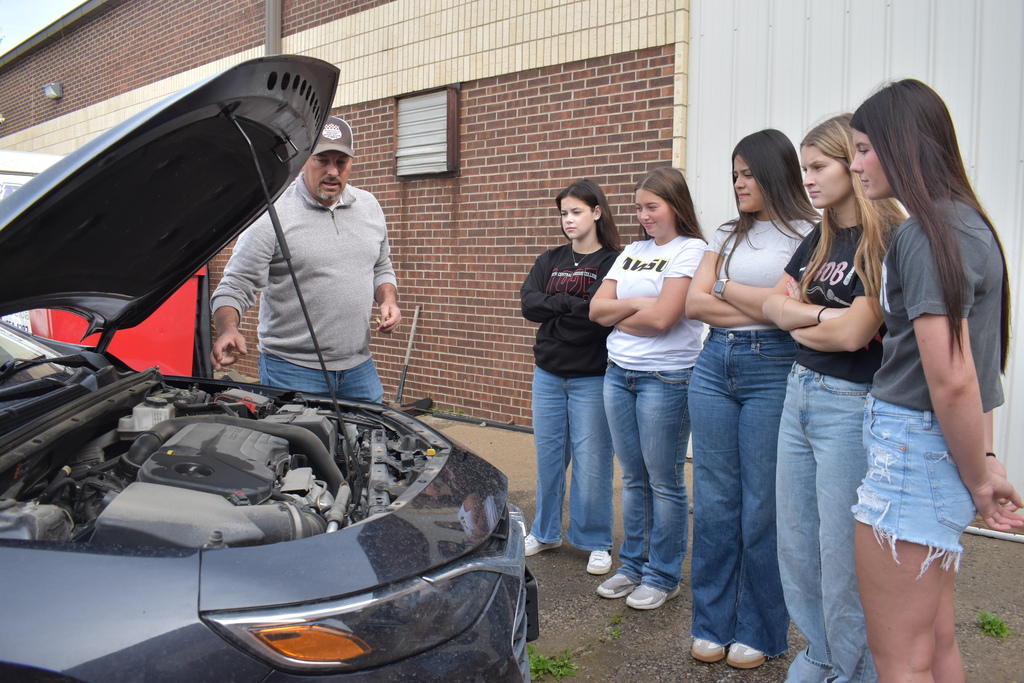 Senior Day at South Harrison; Jeremy VanMeter teaching general maintenance of a vehicle