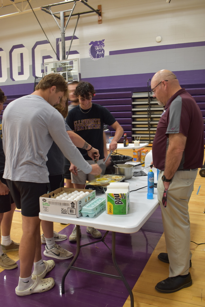 Senior Day at South Harrison; Erik Coffey teaching how to make breakfast such as eggs and pancakes on a griddle