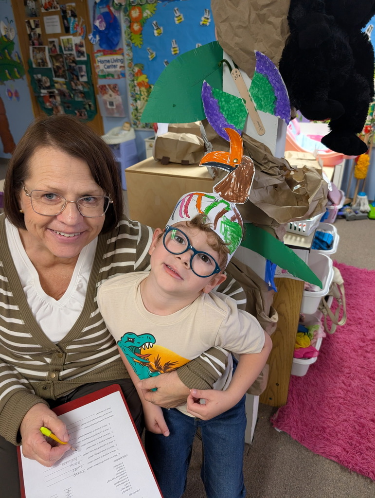 Mrs. Cindy poses with a preschooler on the rainforest tour
