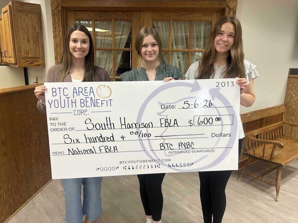 From left to right, Abbe Ream of BTC Area Youth Benefit Corp., Cally Weller, and Karli Forck stand together holding a large $600 donation check supporting the South Harrison FBLA Visual Design Team’s trip to the National Leadership Conference in San Antonio.