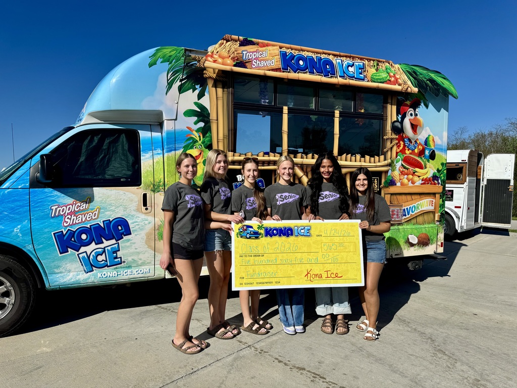 Left to right, Alayden, Lucy, Abby, Lexi, Keeleigh, and Shaylee, representing the South Harrison Class of 2026, pose in front of the Kona Ice truck while holding a Give Back check for $565.