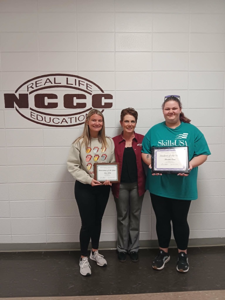 Students holding award certificates