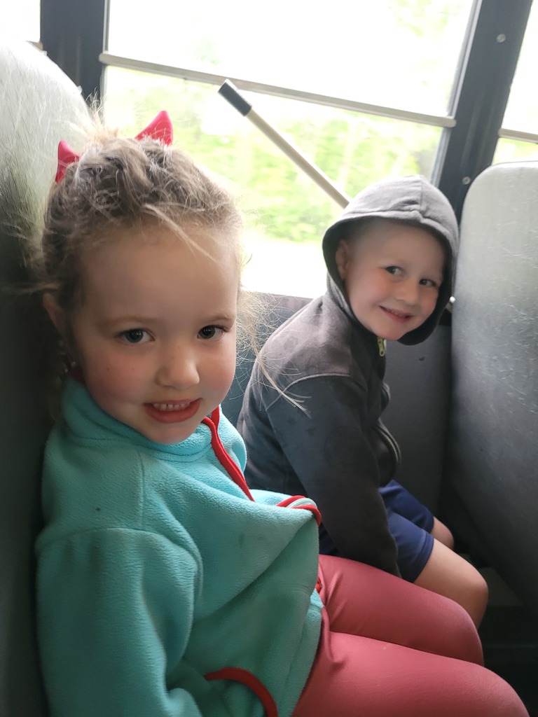 Preschool students from Miss Emily’s class playing outside together during end-of-year activities, enjoying outdoor games, running, and smiling in a park or playground setting.