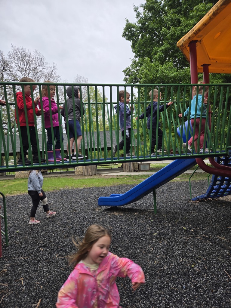 Preschool students from Miss Emily’s class playing outside together during end-of-year activities, enjoying outdoor games, running, and smiling in a park or playground setting.