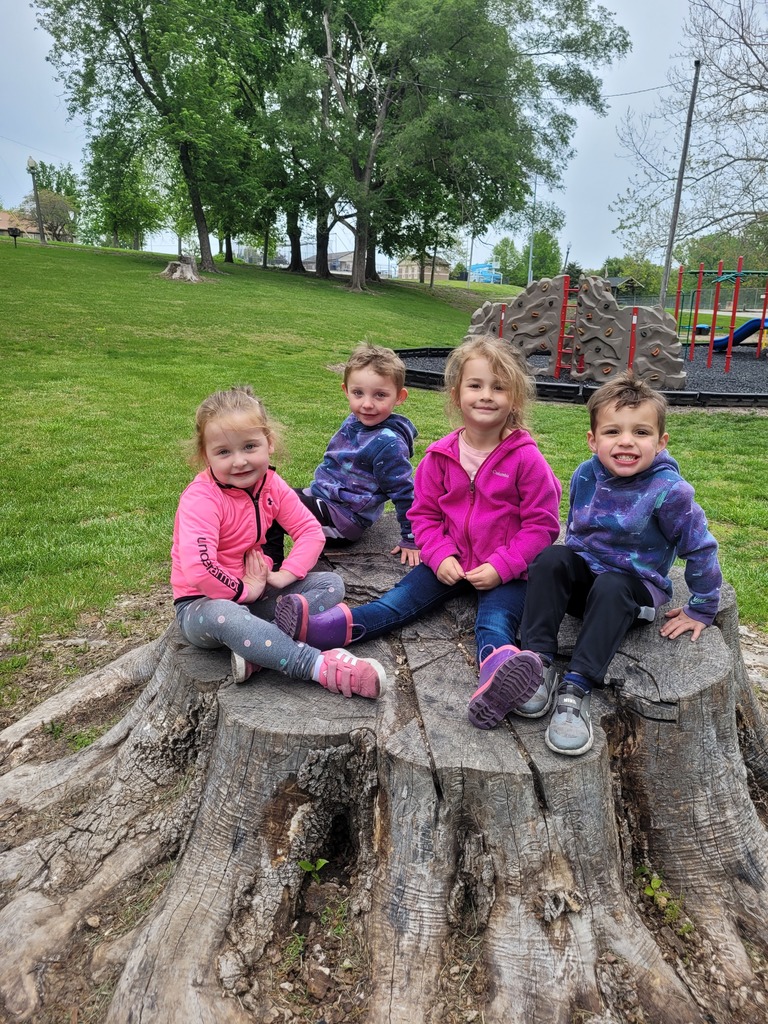 Preschool students from Miss Emily’s class playing outside together during end-of-year activities, enjoying outdoor games, running, and smiling in a park or playground setting.