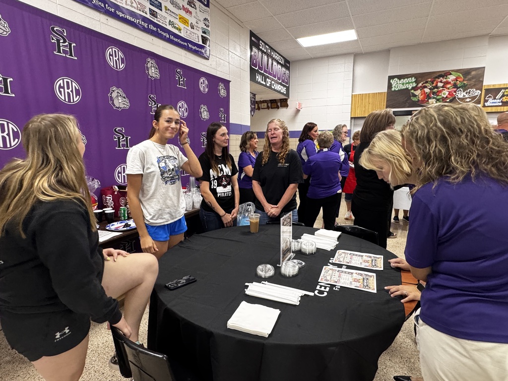 Staff members choose drinks and toppings from the Dirty Soda Bar provided by Century 21.