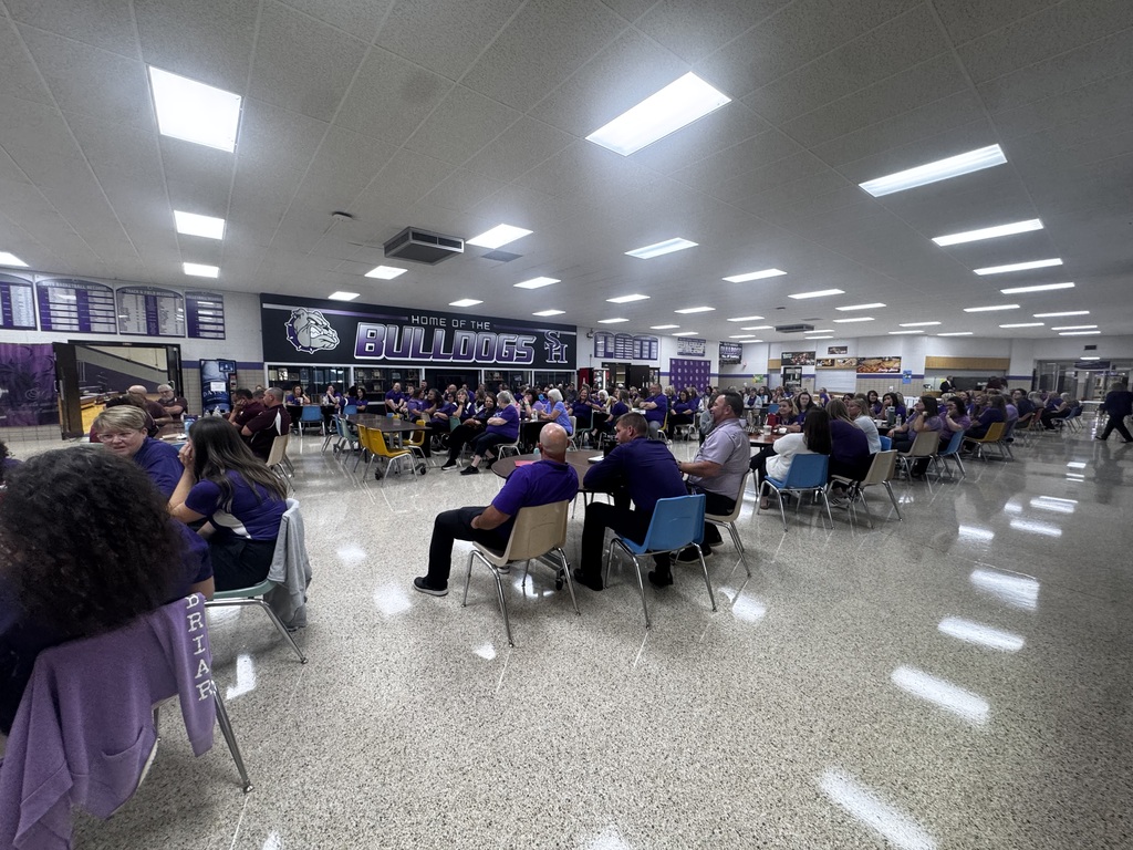 Teachers and staff gather together during the district’s first day back for the new school year.