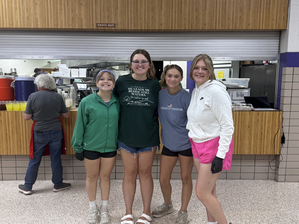 Members of the First Baptist Church Youth Group pose for a picture while serving staff