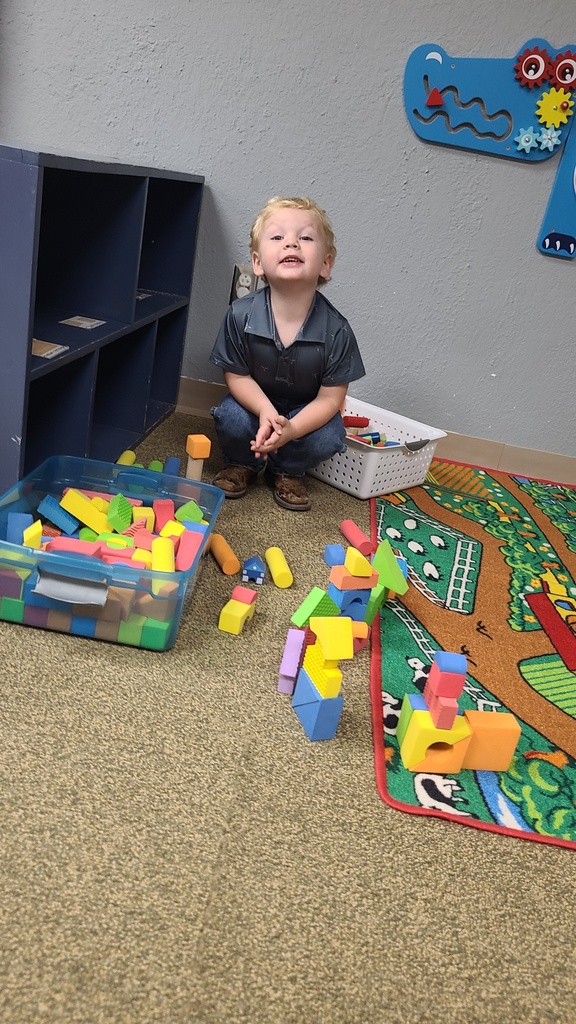 Kid using wooden blocks to play