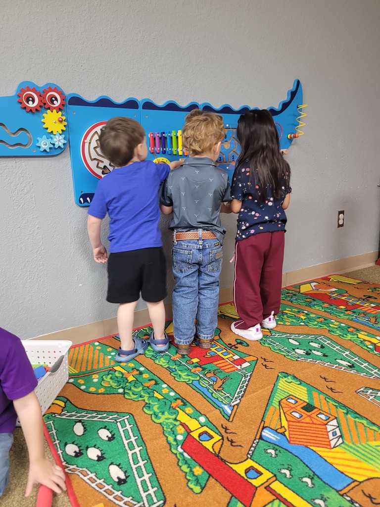 Kids playing with a sensory wall