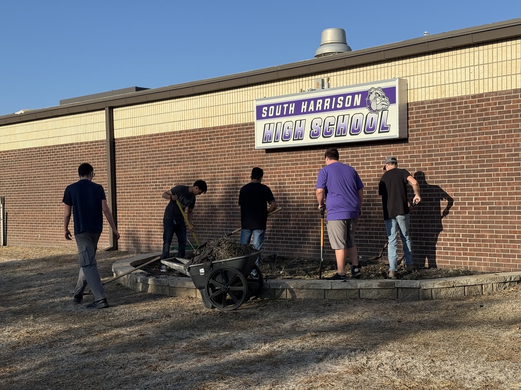 Students work on the new native planting project.