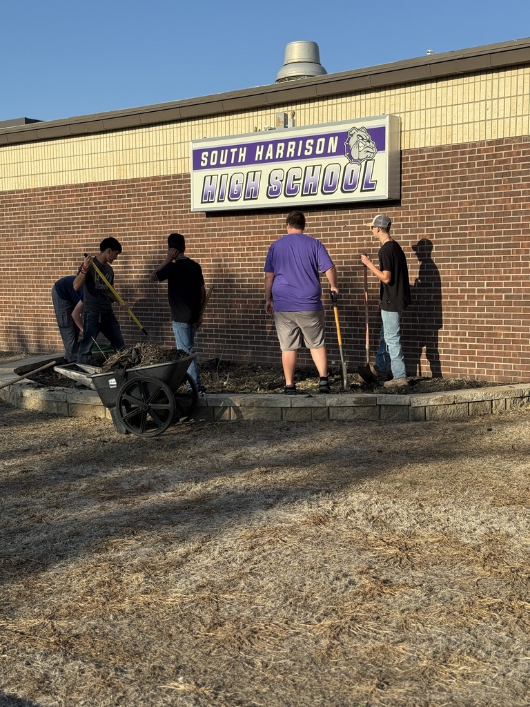 Students work on the new native planting project.