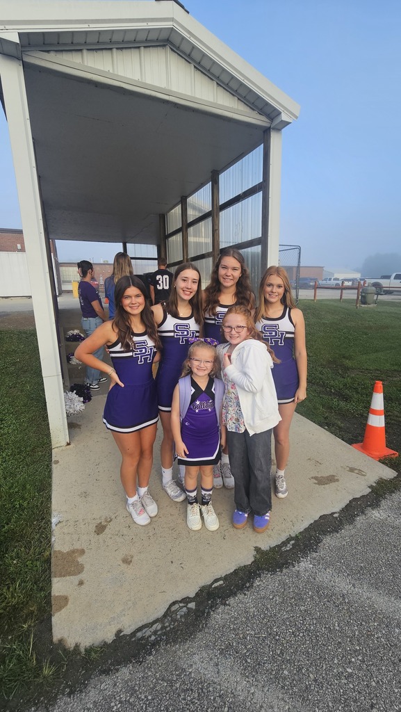 High School Cheerleaders pose with future Bulldog Cheerleaders