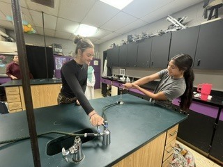 Students are doing a lab mastering the Brunsen Burner