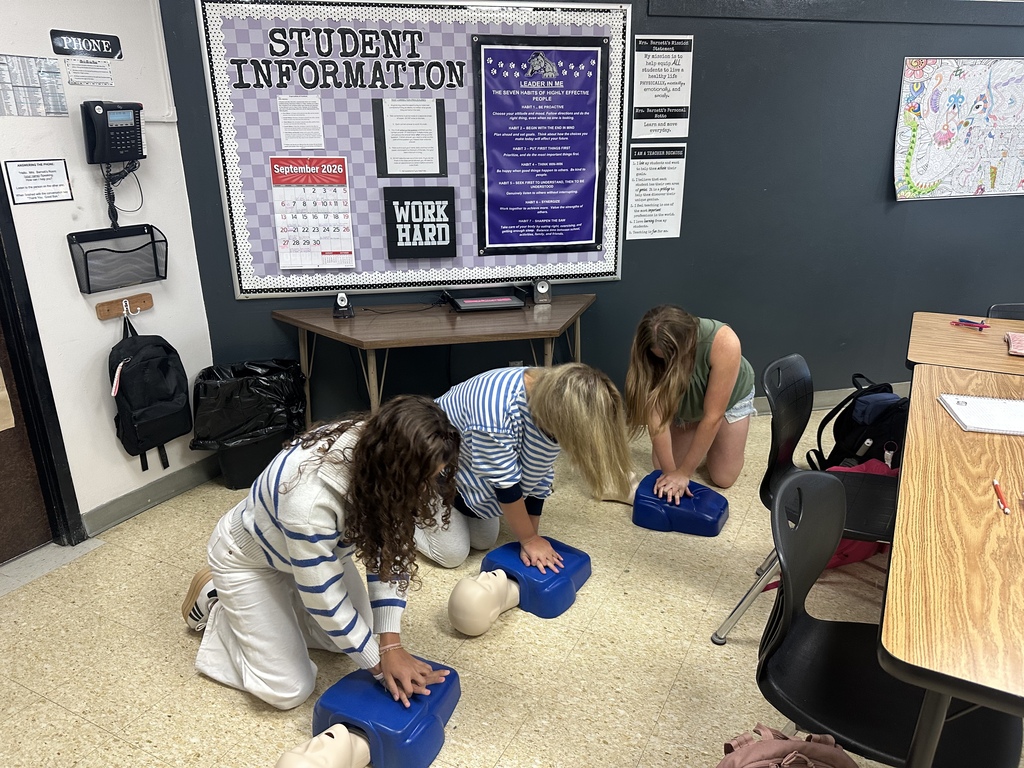 Students practice CPR on mannequins