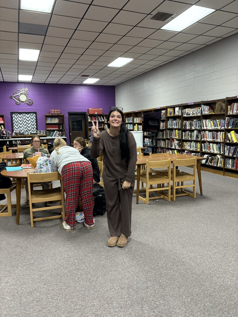 Students wearing Pjs posing for picture