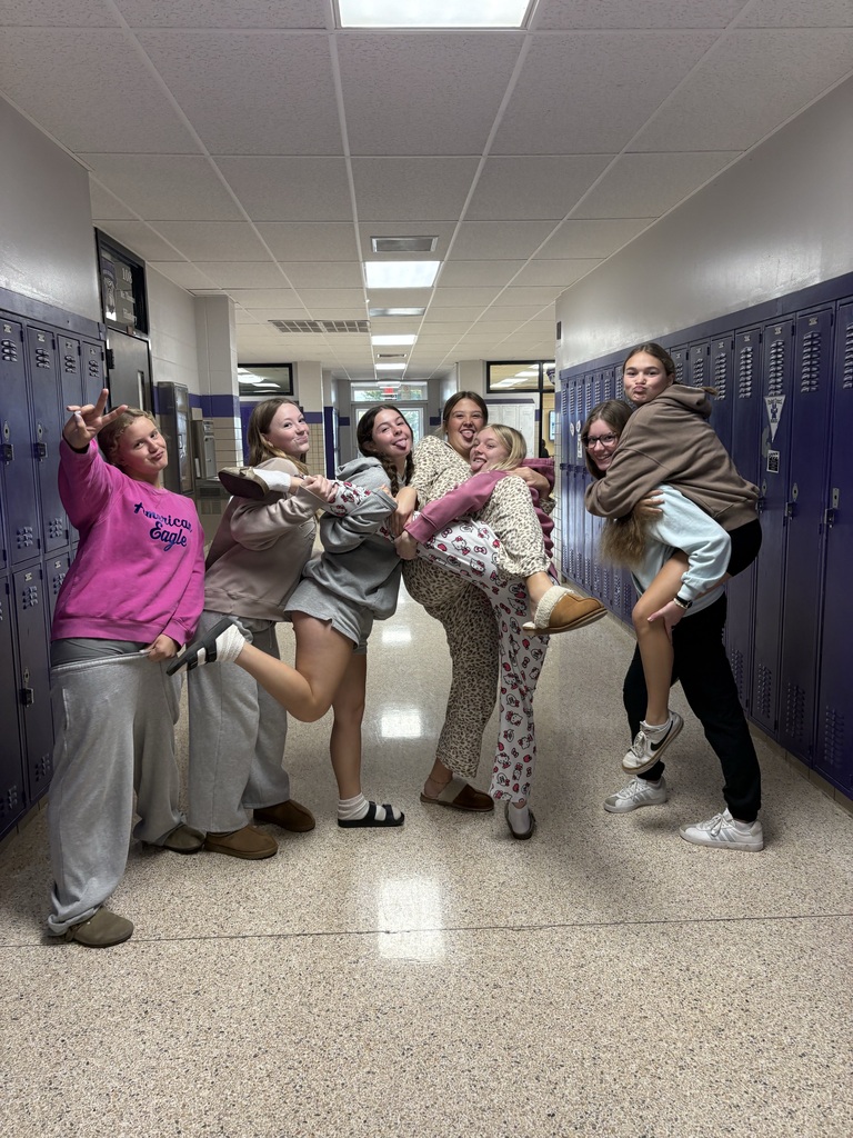 Students wearing Pjs posing for picture