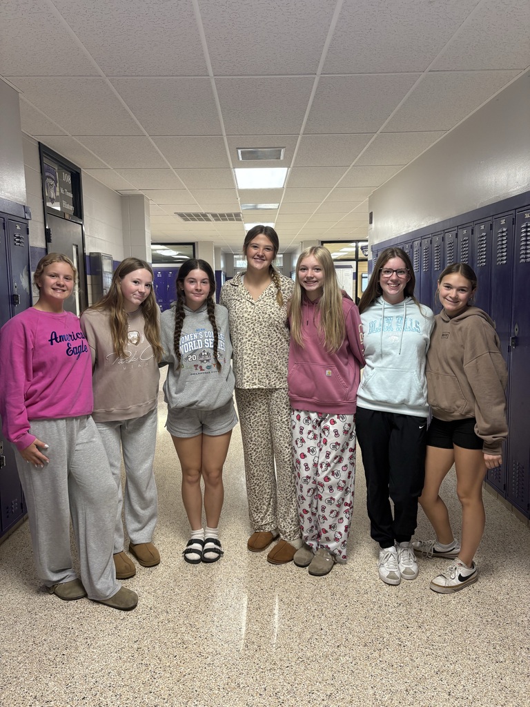 Students wearing Pjs posing for picture