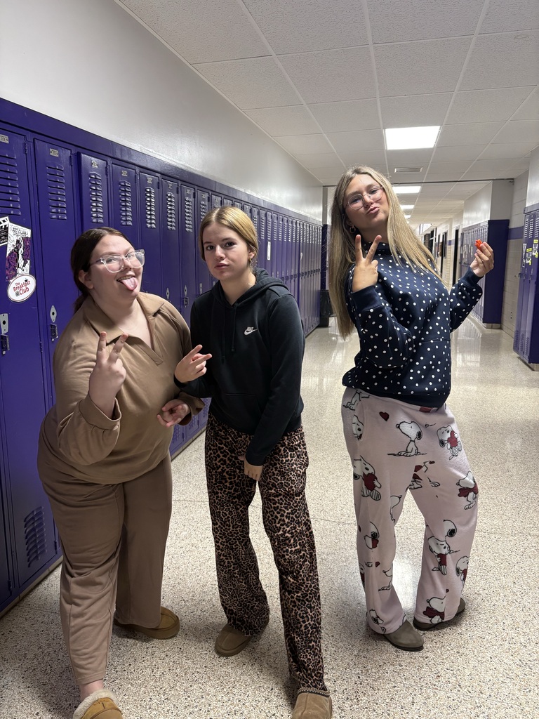 Students wearing Pjs posing for picture