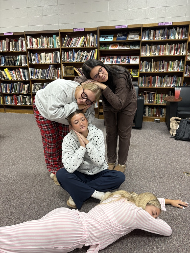 Students wearing Pjs posing for picture