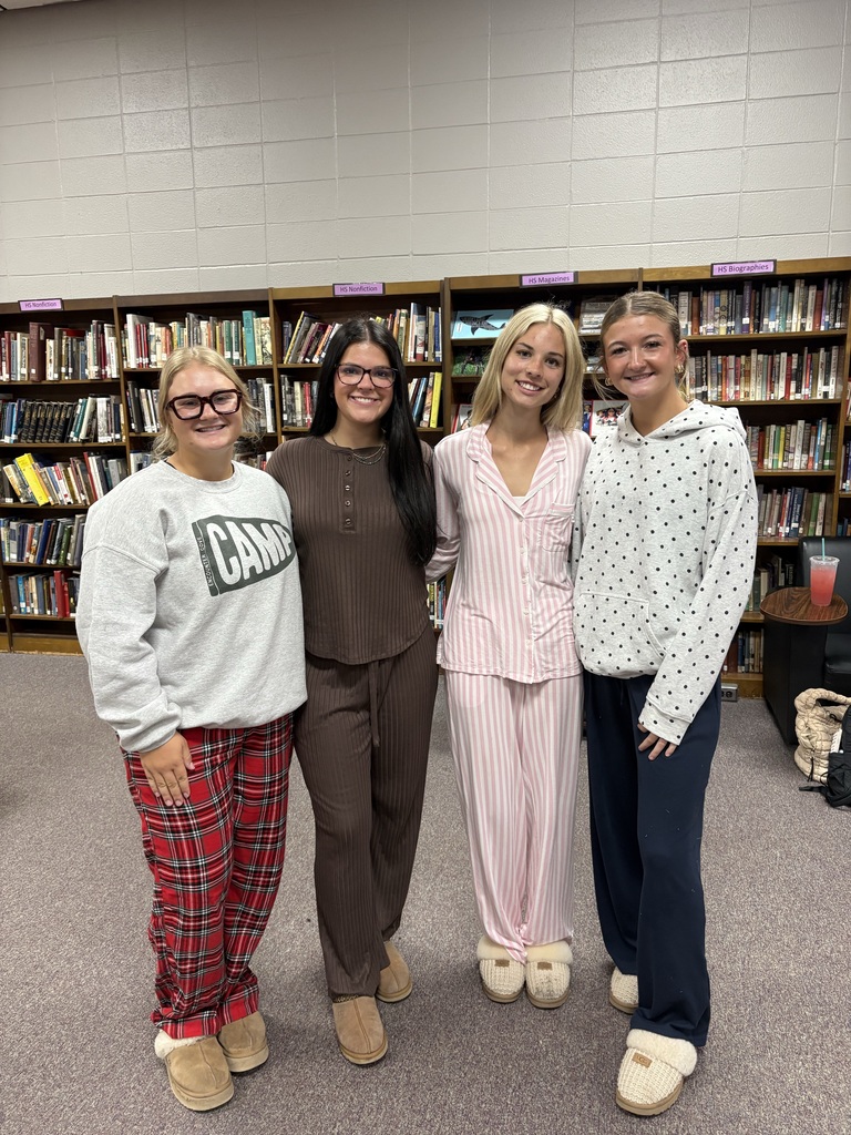 Students wearing Pjs posing for picture