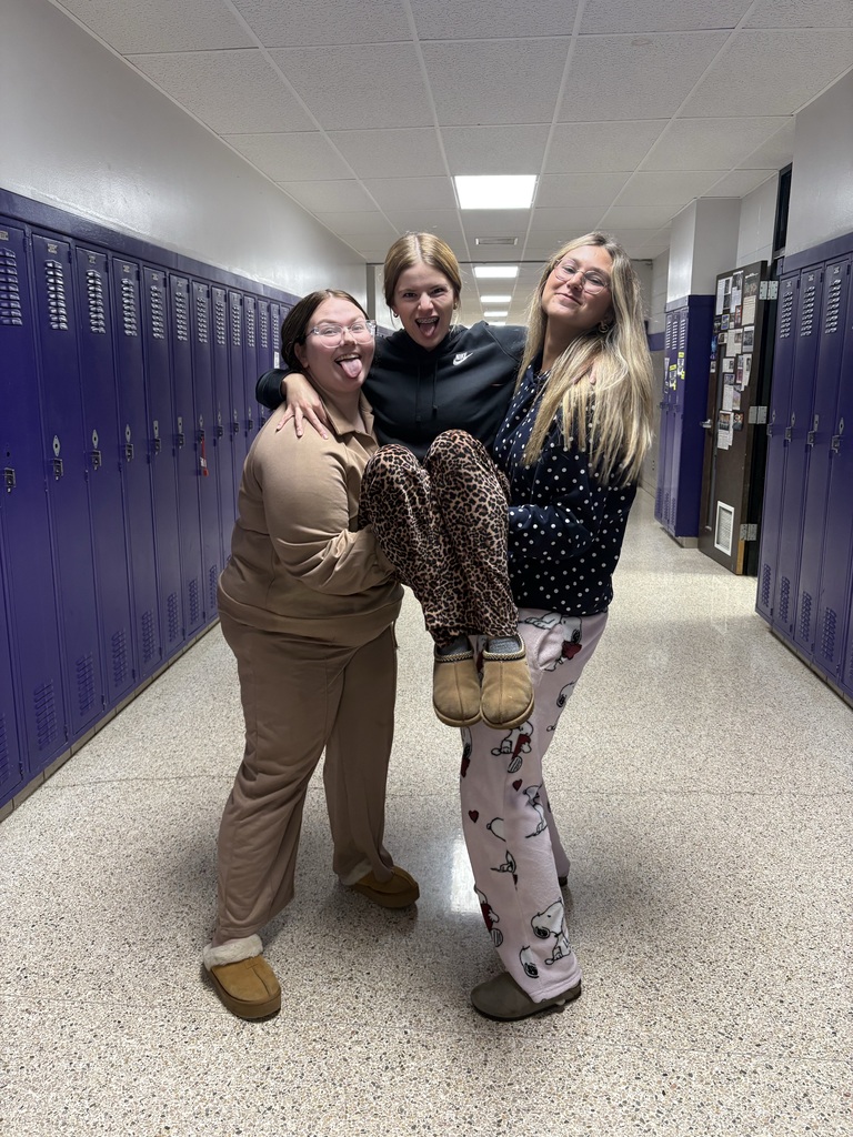 Students wearing Pjs posing for picture