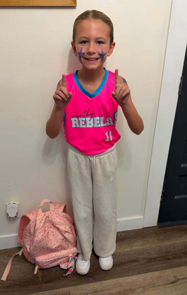 picture of a student wearing souvenir shirt for homecoming dress up day