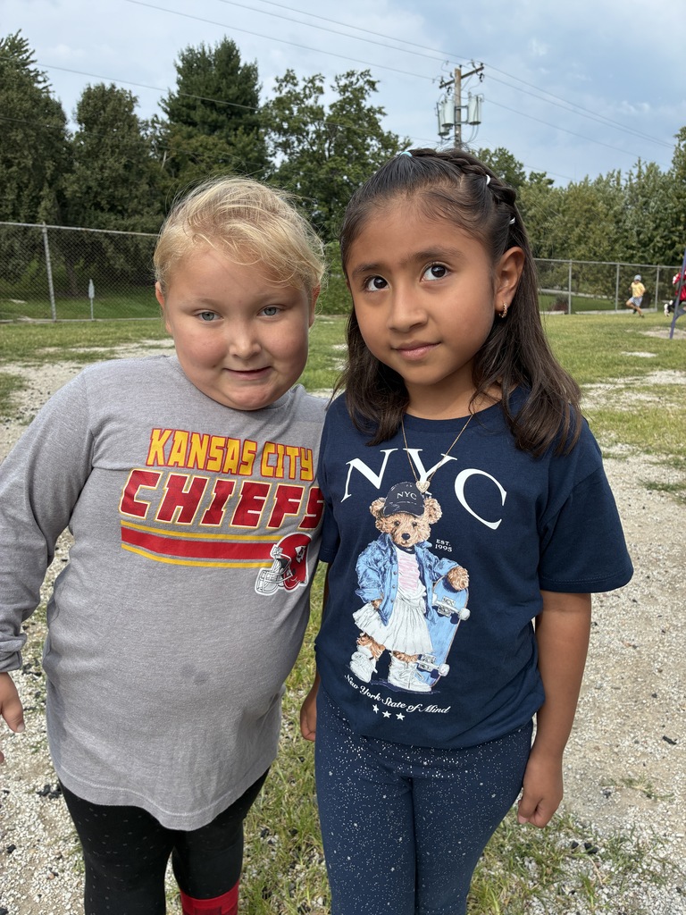 2 students wearing souvenir shirts