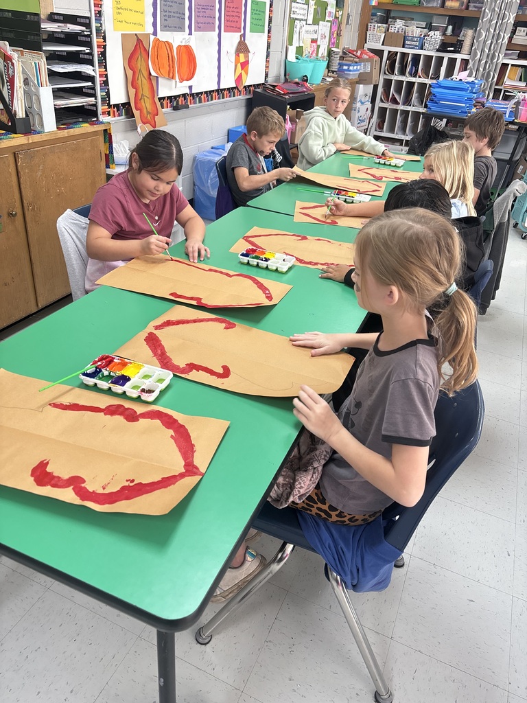 Students in art class painting leaves