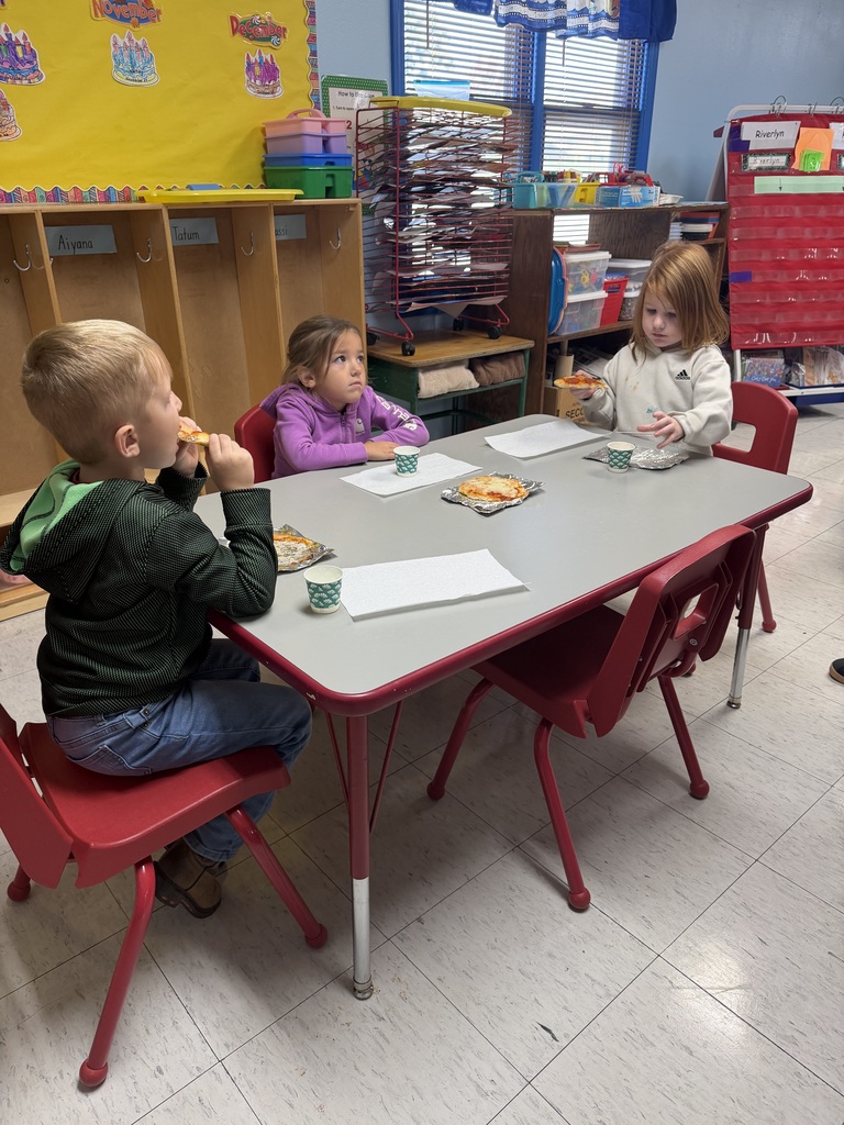 three kids eating pizza