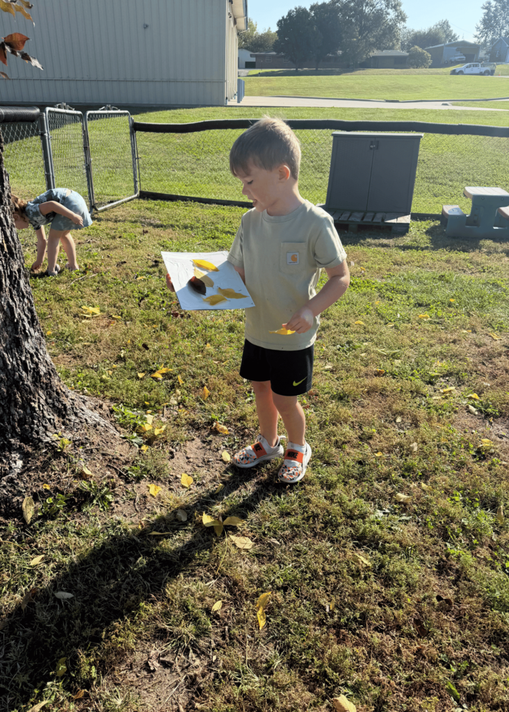 boy holding paper