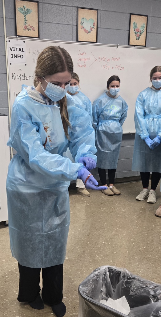 Girl taking off gloves correctly.