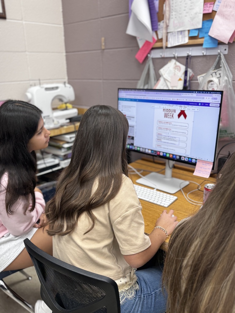 Nora McCall and Victoria Padron, Middle school page, working on graphics