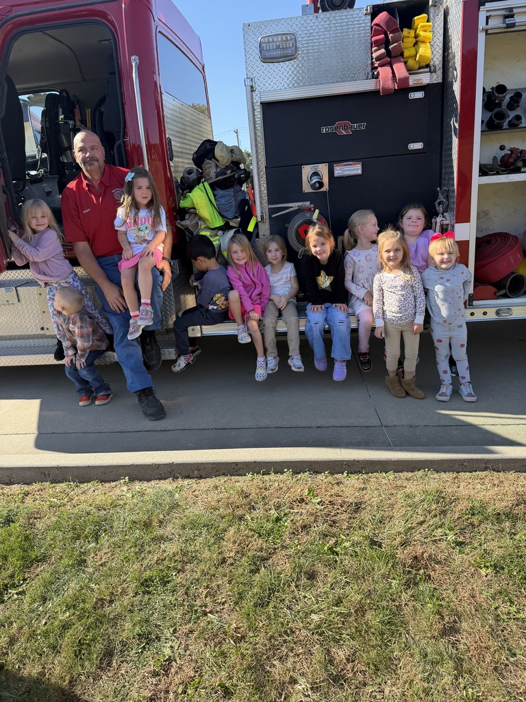 kids picture outside firetruck