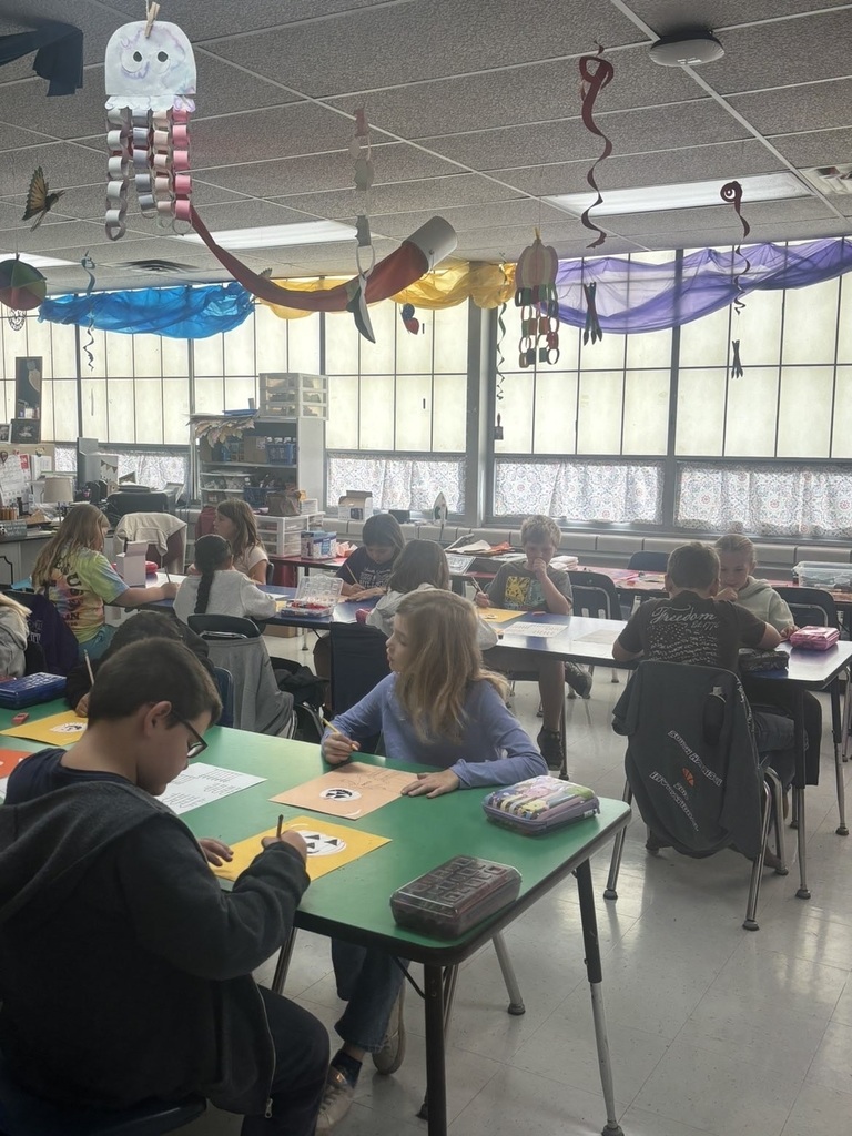 students in the art room doing an art project