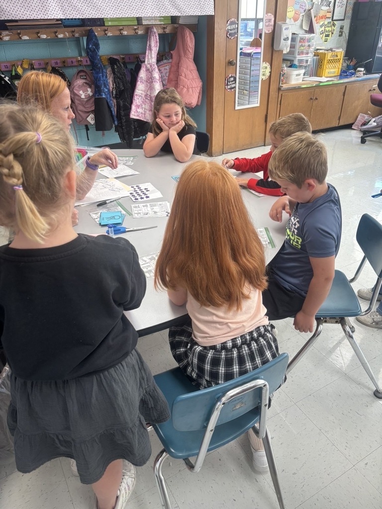 students sitting with mrs. rector in small groups