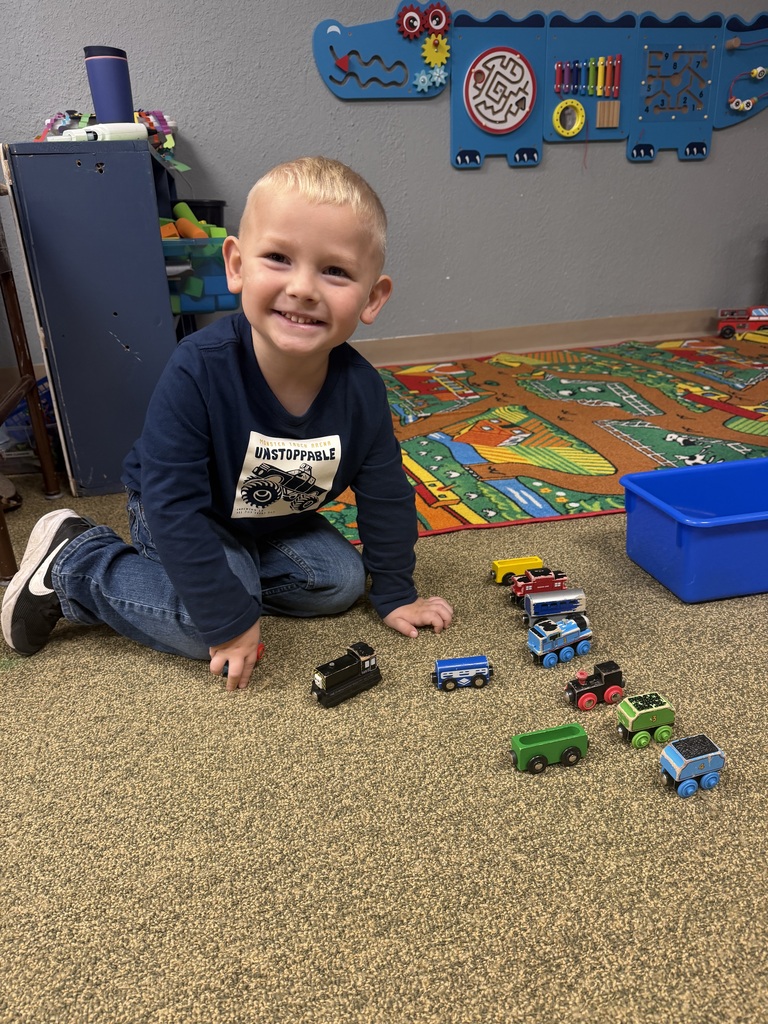 boy playing with trucks