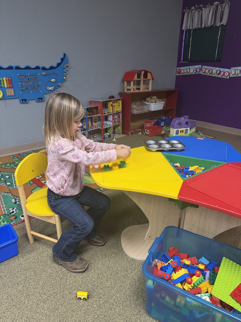girl playimg with legos