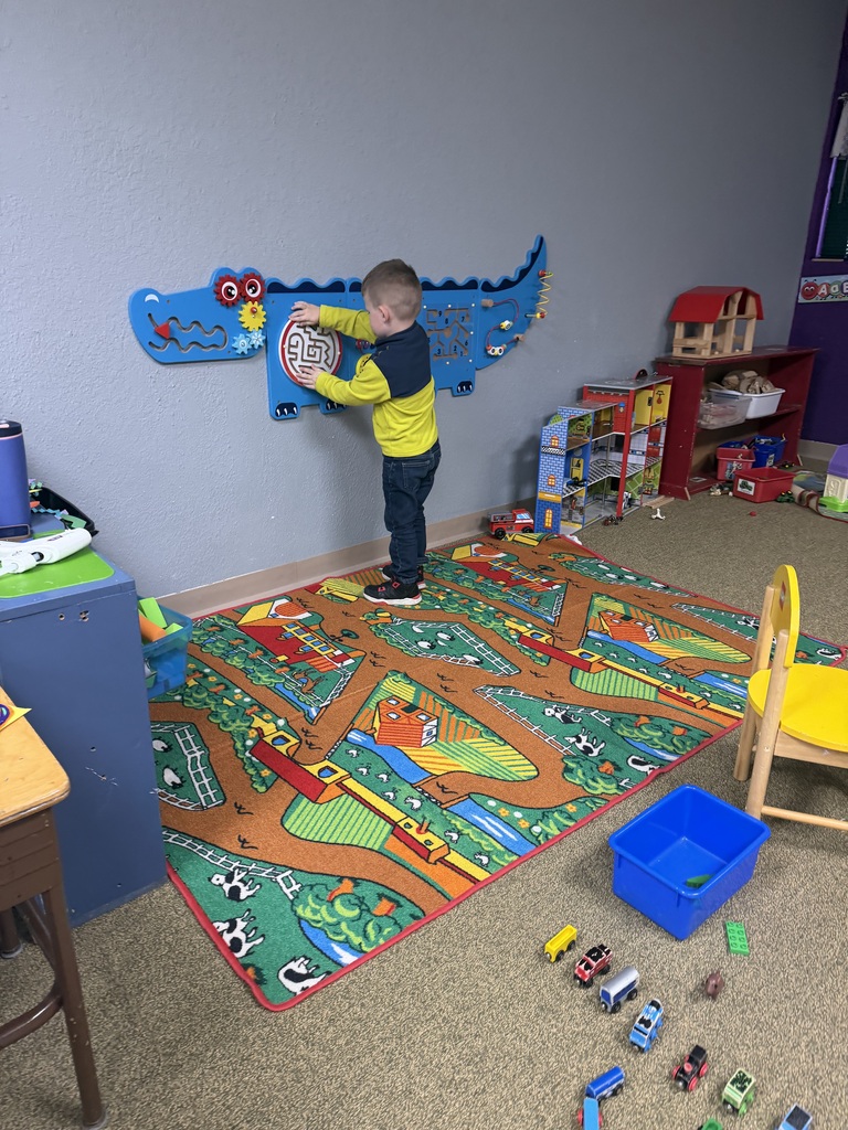 boy playing with sound wall