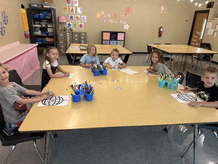 First graders hard at work on their “All About Me” disco balls!