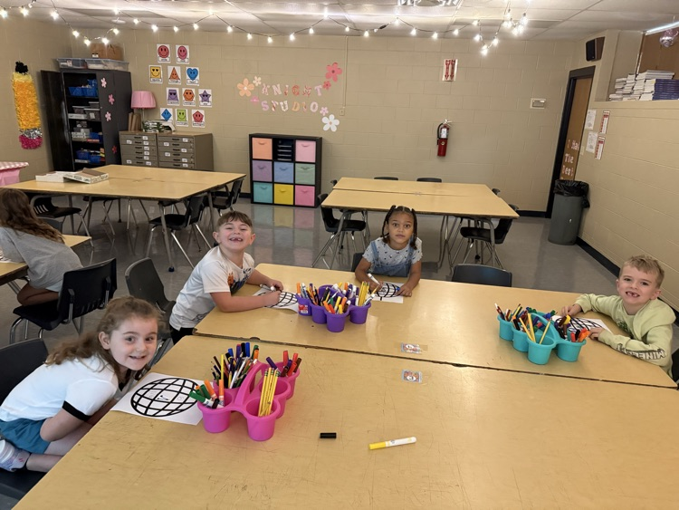 First graders hard at work on their “All About Me” disco balls