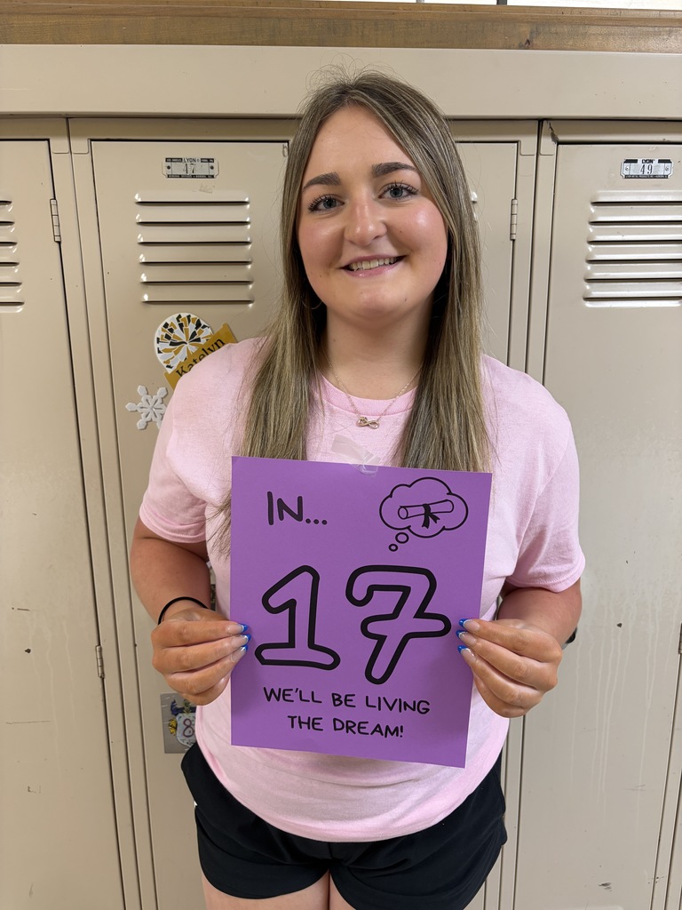 Student holding sign